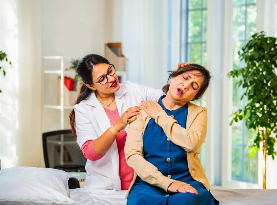 Indian,Asian,Young,Female,Doctor,,Physiotherapist,Carefully,Examining,The,Shoulder,